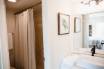 Freshly decorated and stocked with fluffy towels and complimentary soaps for your stay. We like to offer a touch of  lux. Vanity area separate from shower and loo in master bath. 